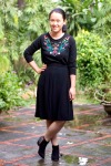 embroidered sweater black skirt black ankle boots by 14 shades of grey
