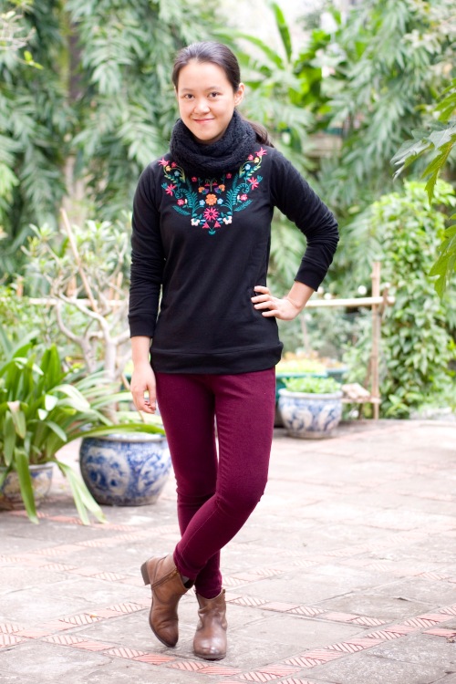black embroidered sweatshirt maroon jeans brown ankle boots by 14 shades of grey